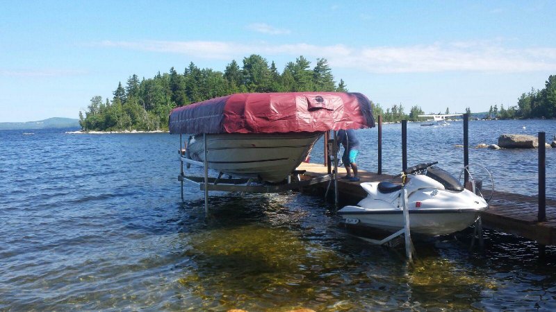 ( GM 45120 V-Hull ) 4500# 120" wide Eastern Township Boatlift with a 12" x 24' Maroon Canopy plus a 1200# PWC Watercraft Lift.